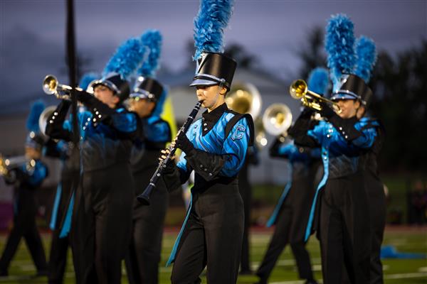 The Centennial High marching band performs